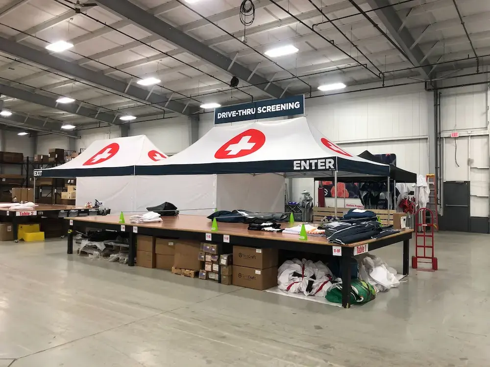 two side-by-side drive thru hospital screening tents on the production floor of TentCraft in Traverse City, MI