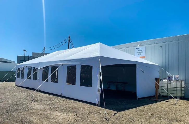 Frame tent with windows and stake ballasting